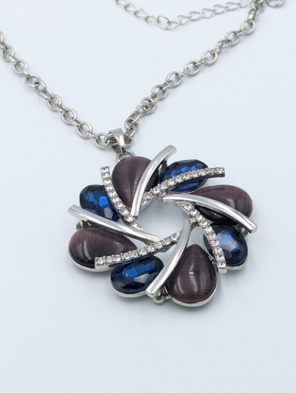 Large blue rhinestone silver tone pendant necklace on long silver tone chain